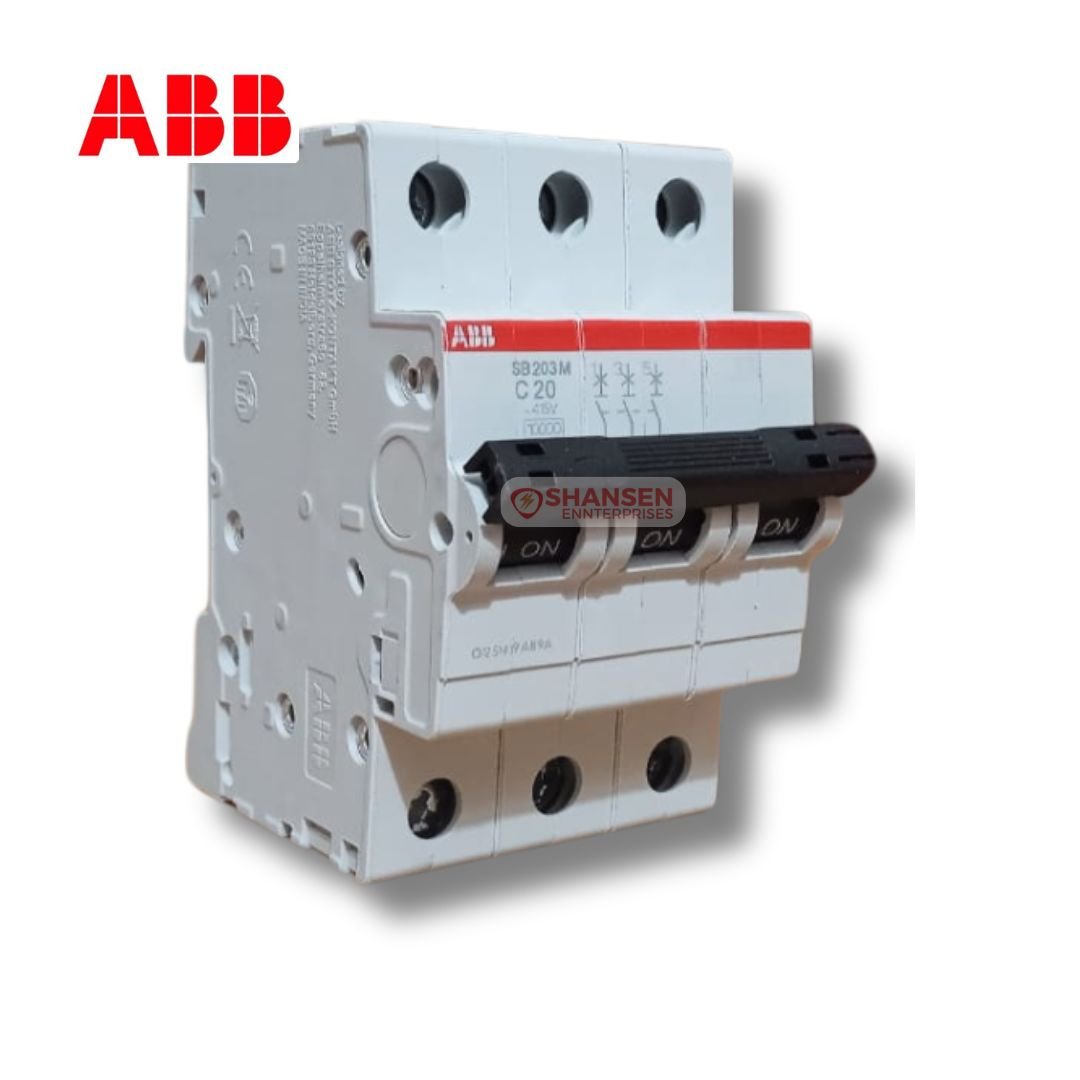 The image shows an ABB SB203M-C20 Miniature Circuit Breaker (MCB) with three poles and a C20 rating. The breaker has a white body with a red ABB logo on top. The black switch toggles are labeled "ON." The Shansen Enterprises watermark is visible