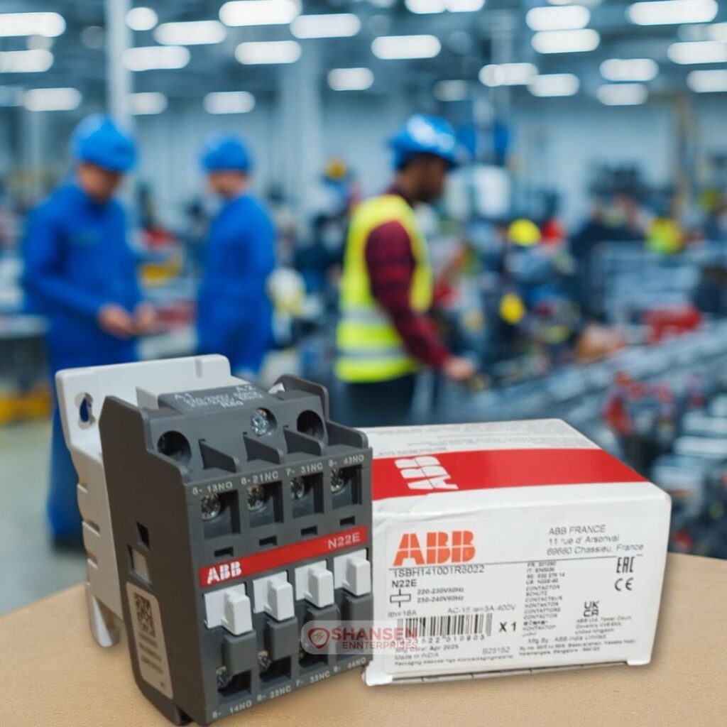 ABB N22E relay with original box in a factory setting with blue-uniformed engineers - Shansen Enterprises